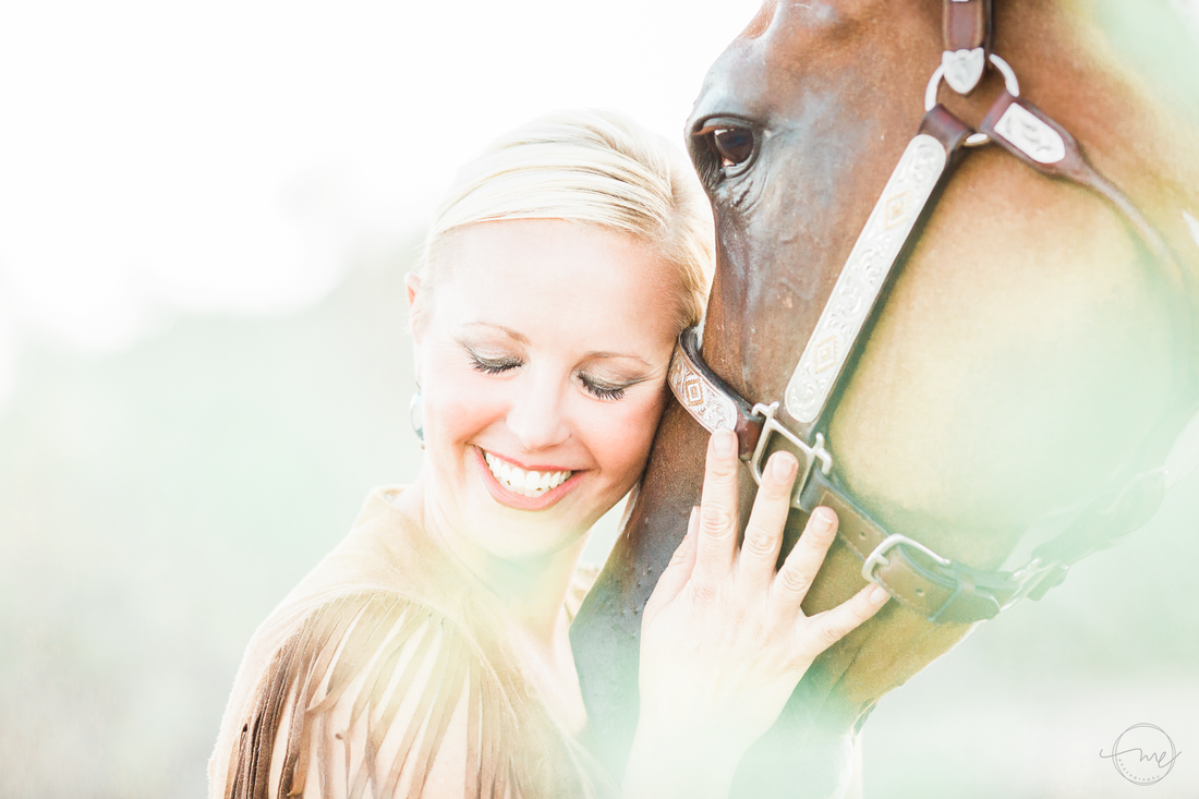 Author Carly Kade poses with her horse for Melanie Elise Photography