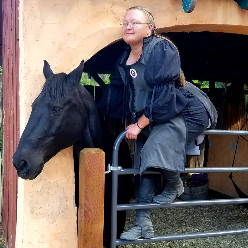 Author J.D. Harrison and her horse